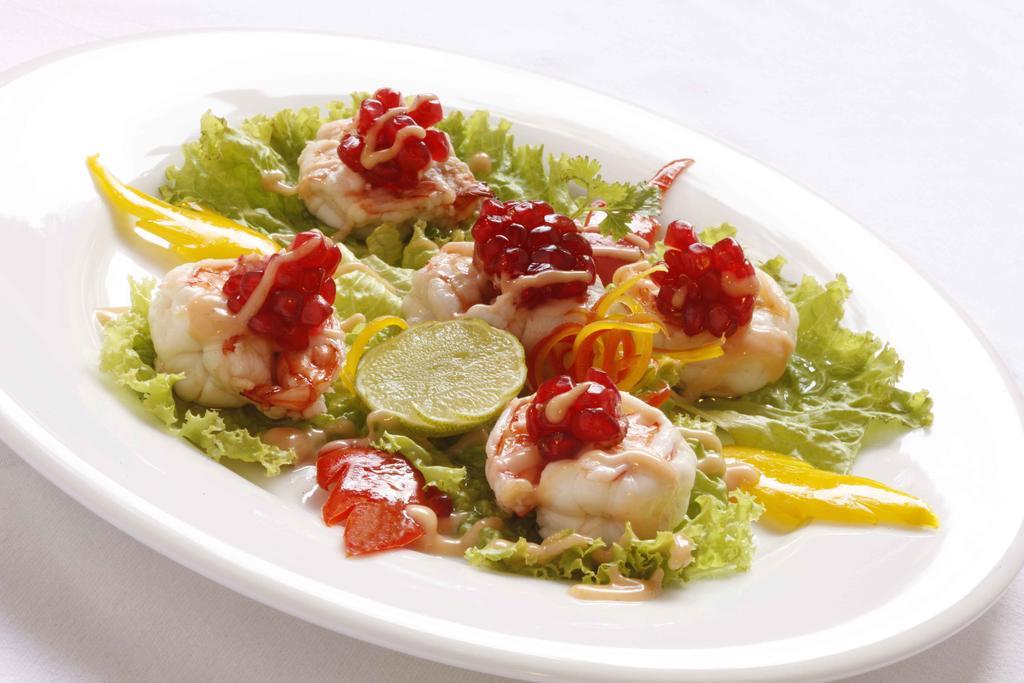 Heritage Madurai Exterior photo A salad of scallops
